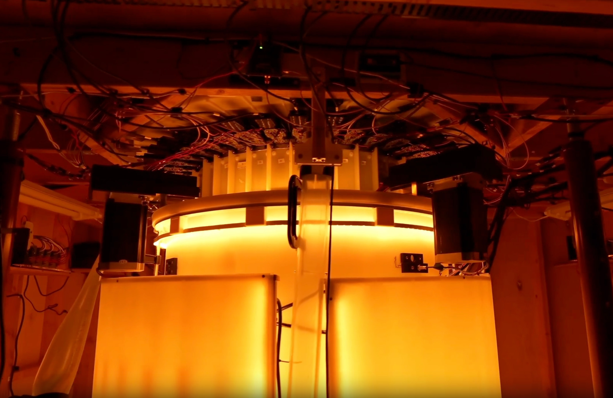 A still from Midjourney's promotional video showing the scanner tank that a person would be lowered into for ultrasonic CT imaging